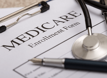 Medicare enrollment form on a clipboard