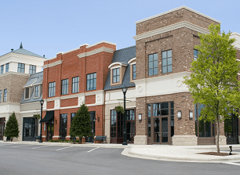 several commercial store fronts in a shopping center