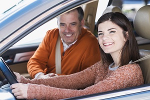Girl with dad in car